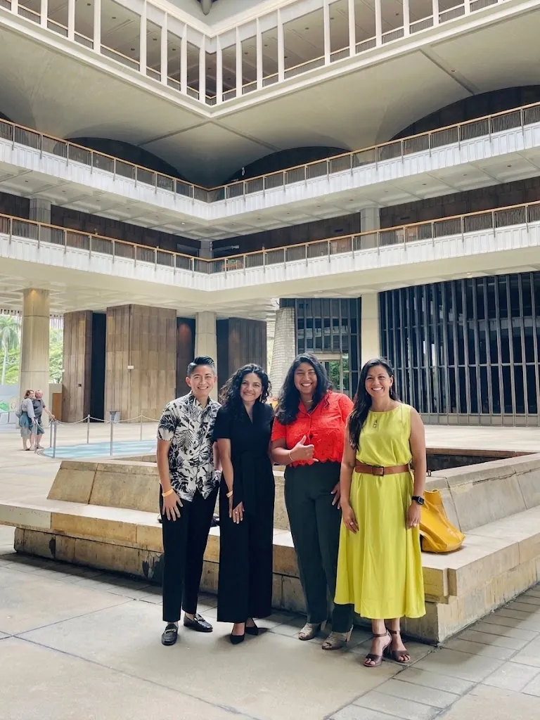 Four energy professionals standing in a government atrium